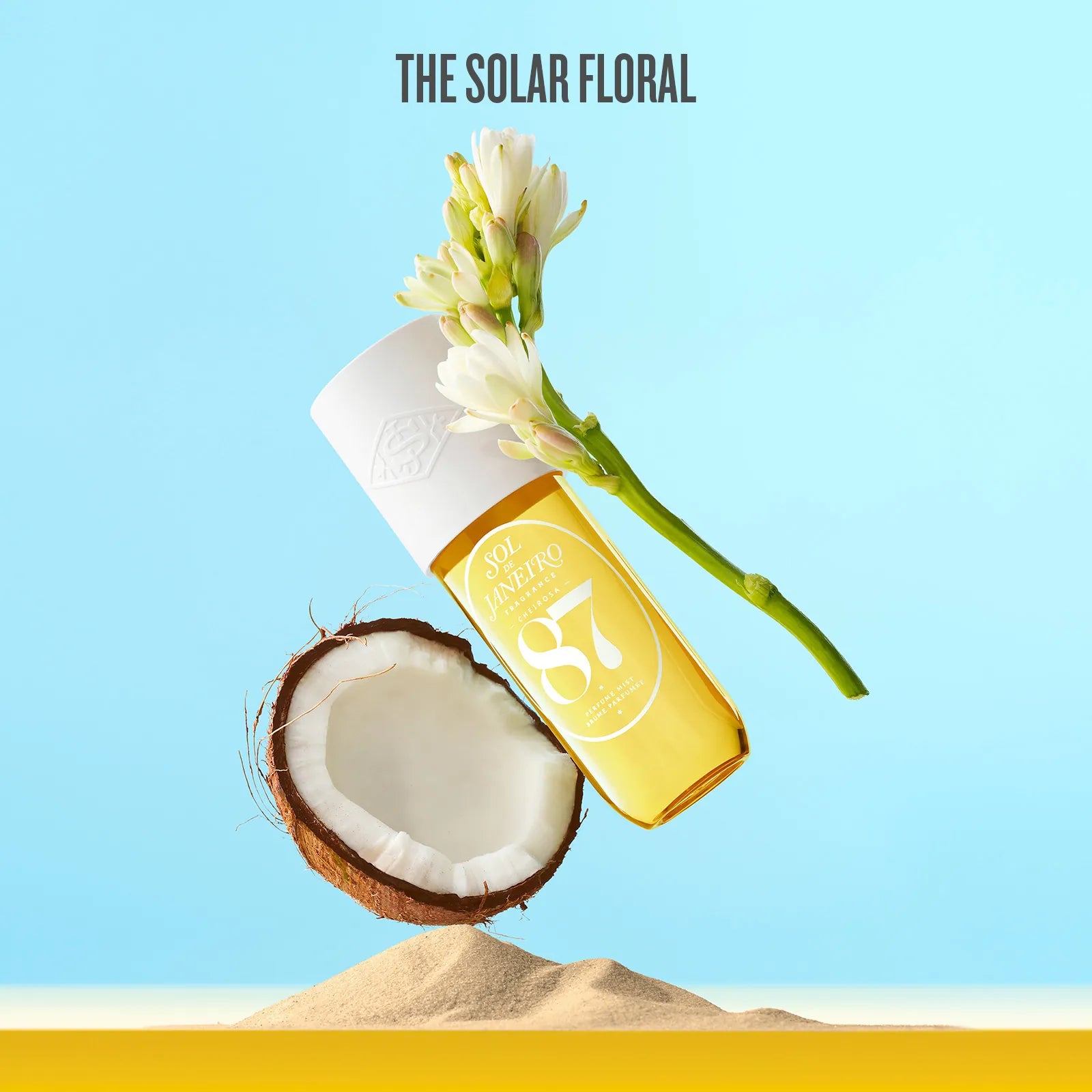 Bottle of coconut oil with a flower on a blue background, featuring 'The Solar Floral' brand.