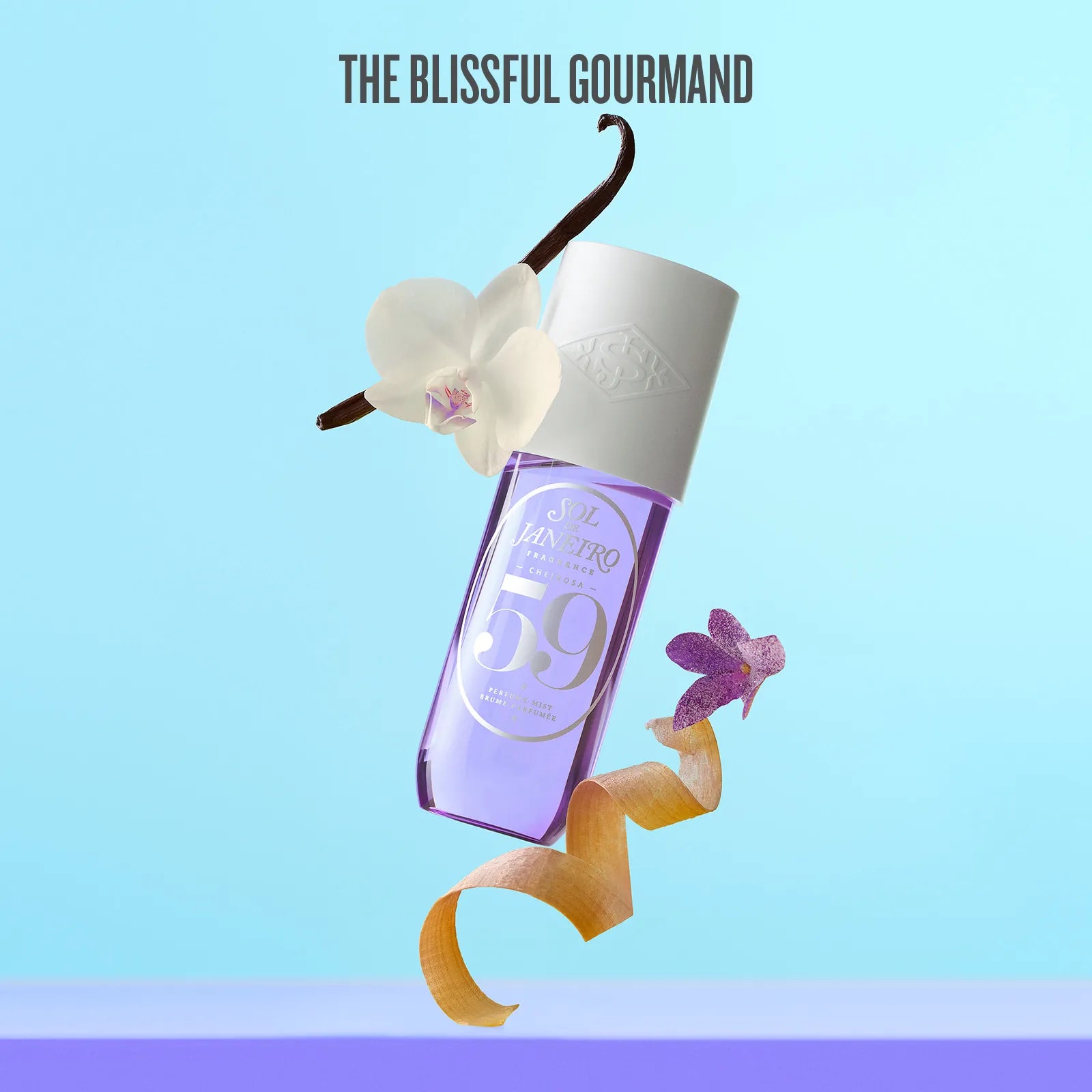 Perfume bottle with vanilla bean and orchid on a light blue background, featuring 'The Blissful Gourmand' brand.