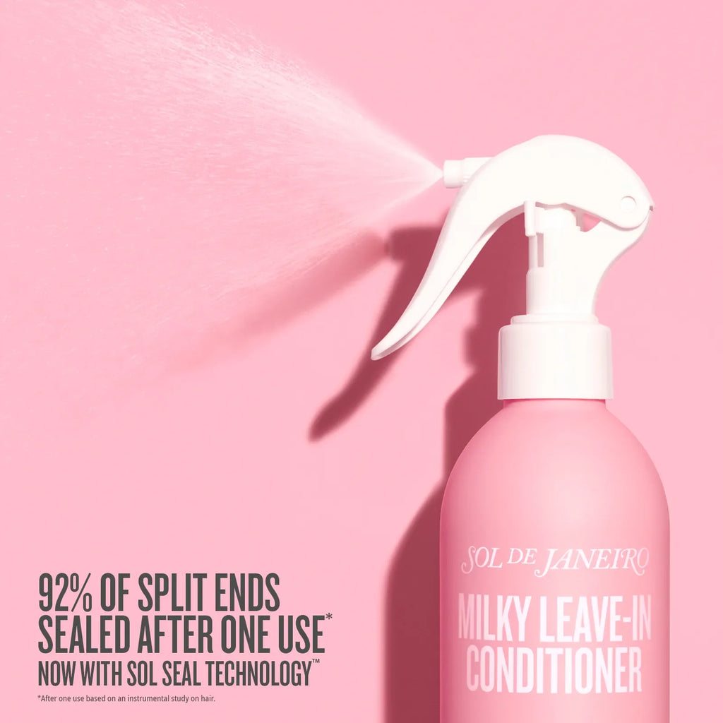 Pink Sol de Janeiro Milky Leave-In Conditioner bottle with white spray nozzle on a pink background