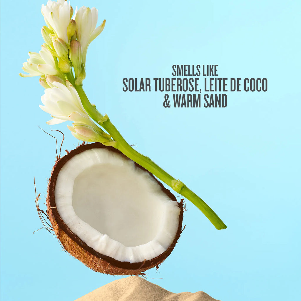 Coconut half with a flower on a blue background, labeled with fragrance notes.