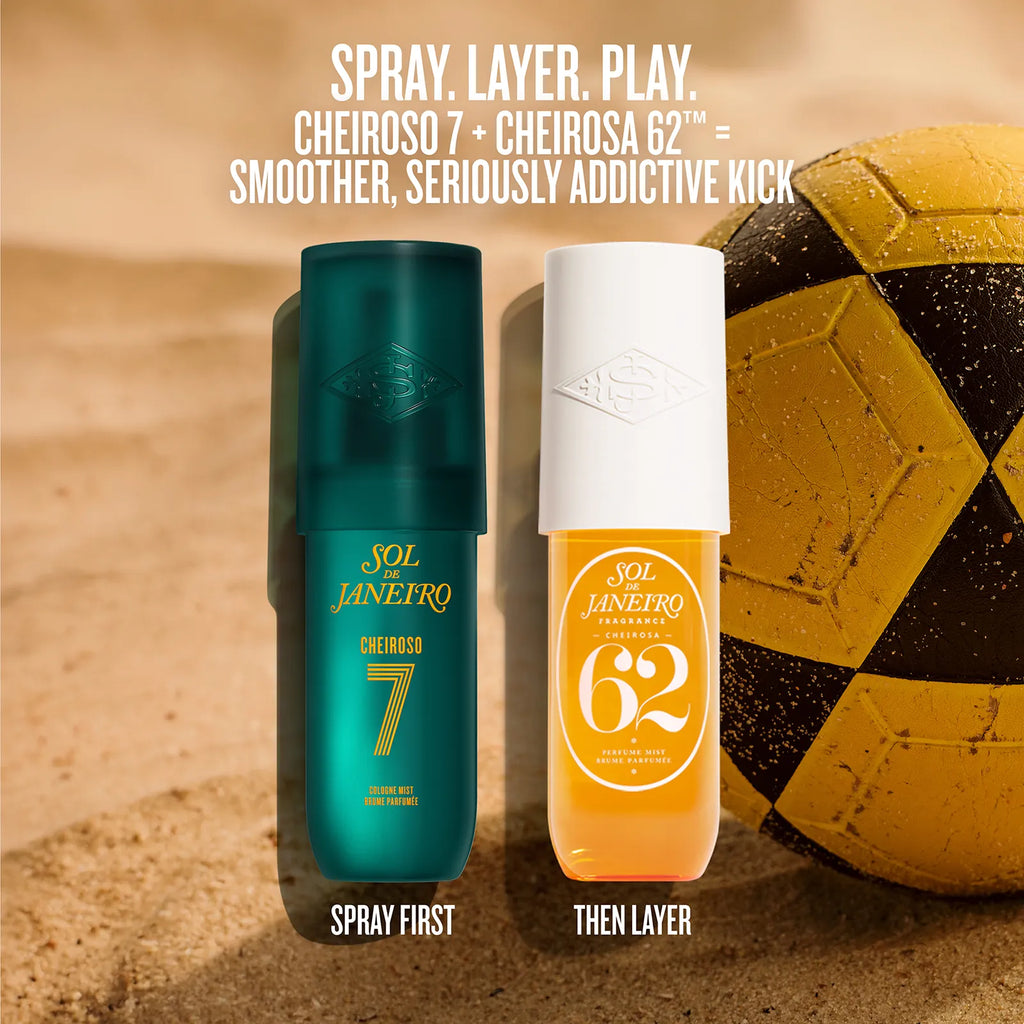 Two bottles of Sol Janeiro Cheiroso 7 and Cheiroso 62 perfume spray standing side by side on a sandy surface, with a yellow and black soccer ball in the background. White text at the top reads 'SPRAY.