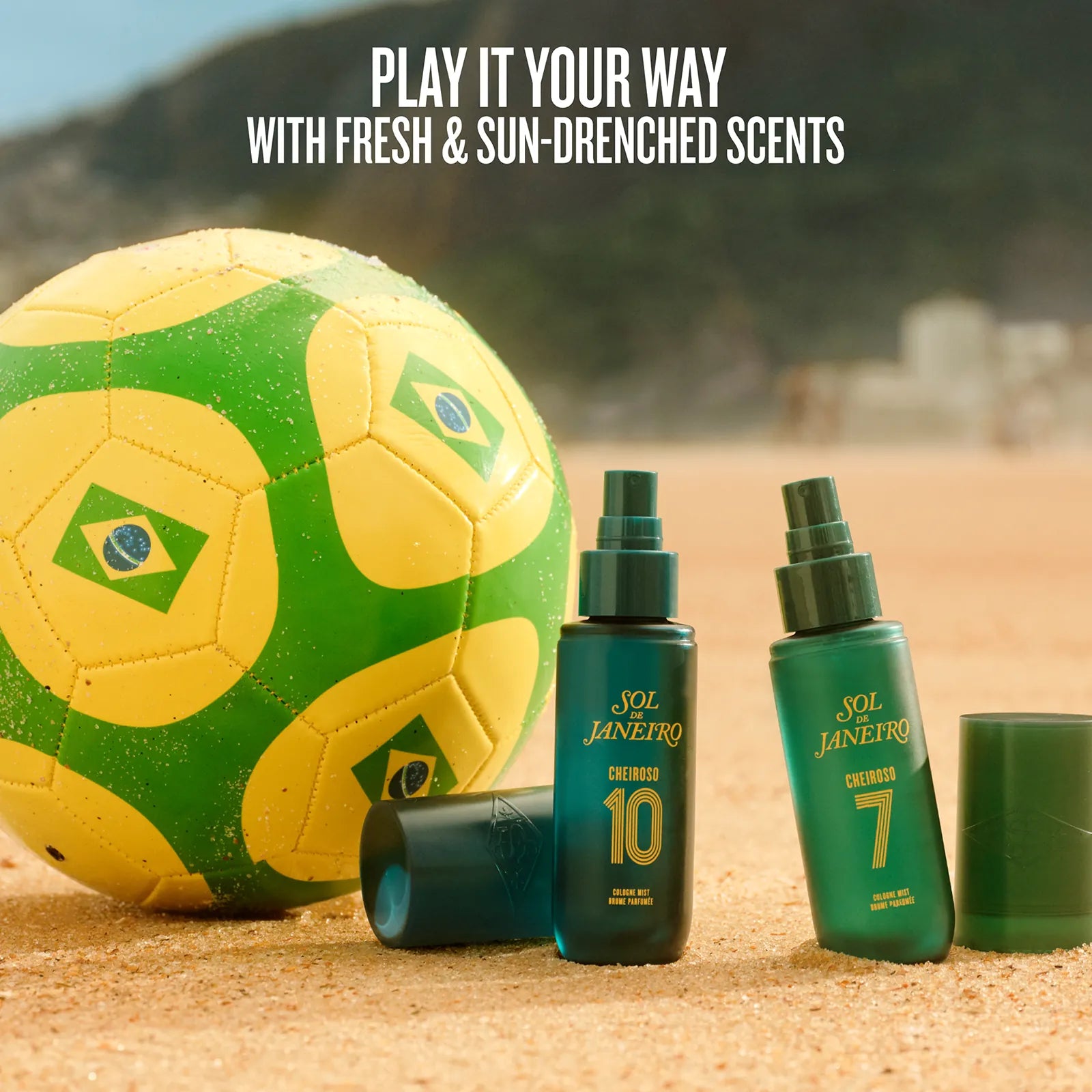 Soccer ball and Sol de Janeiro sun lotion bottles on sand with promotional text.