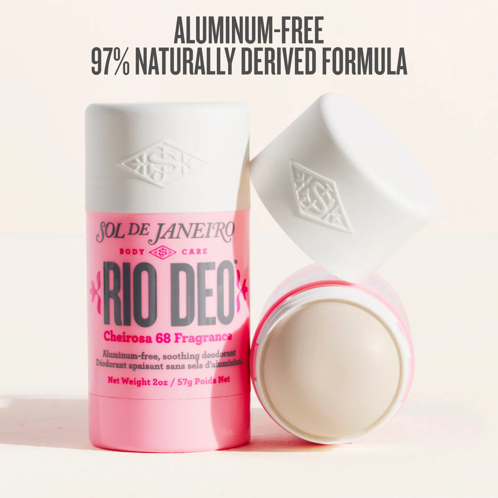 Pink deodorant container with white cap on a light pink background, featuring text about an aluminum-free formula.